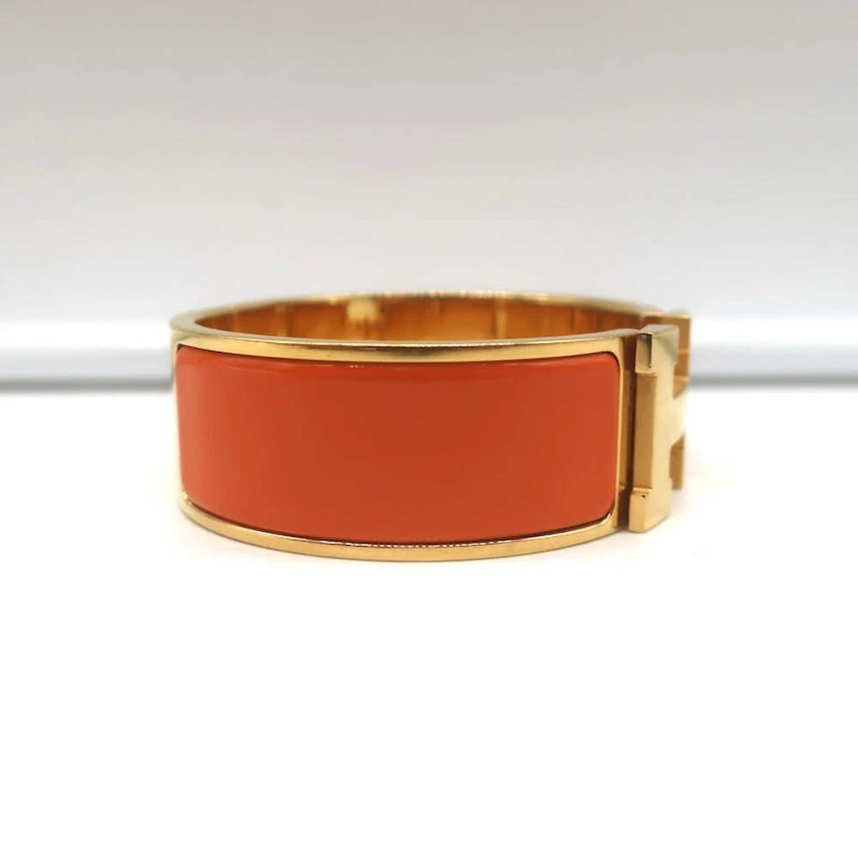Pulsera Hermes Clic Clac H PM Esmalte Naranja y Oro Foto 4 de 4