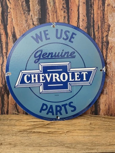 VINTAGE WE USE GENUINE CHEVROLET PARTS PORCELAIN SIGN 12" IN DIAMETER- NICE
