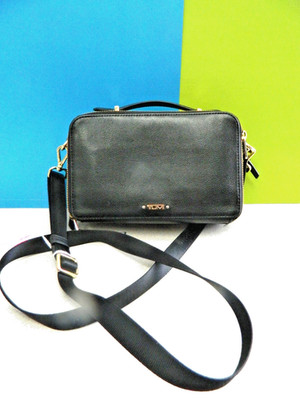 TUMI Black Solid Crossbody Bag Zip Closure Gold Hardware Detachable Strap