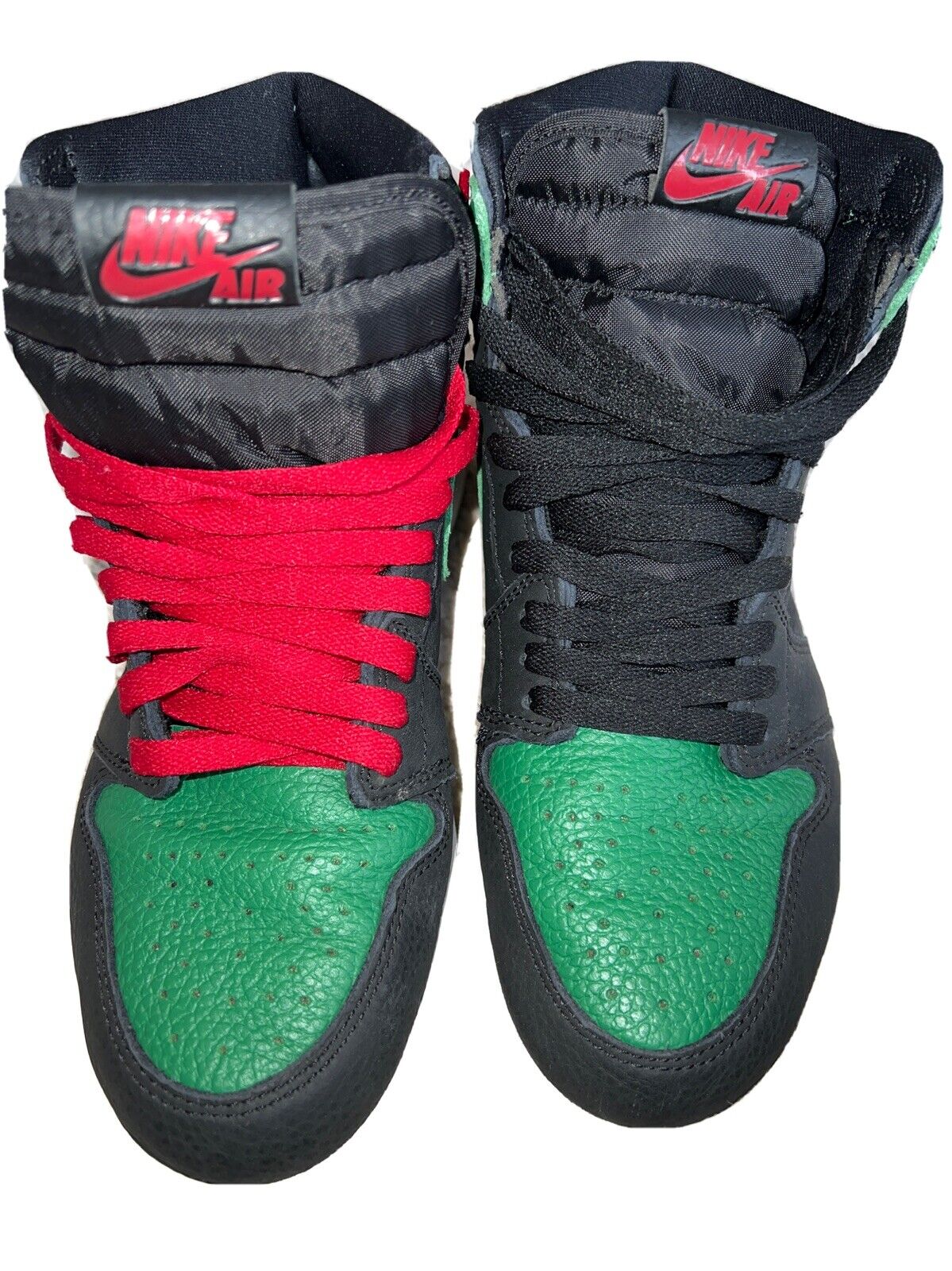 green and black jordan 1 with red laces