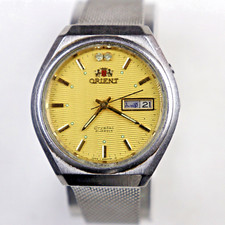 Vintage ORIENT Crystal 21J Automatic IT487607-6C PT Patterned Gold Dial Day/Date