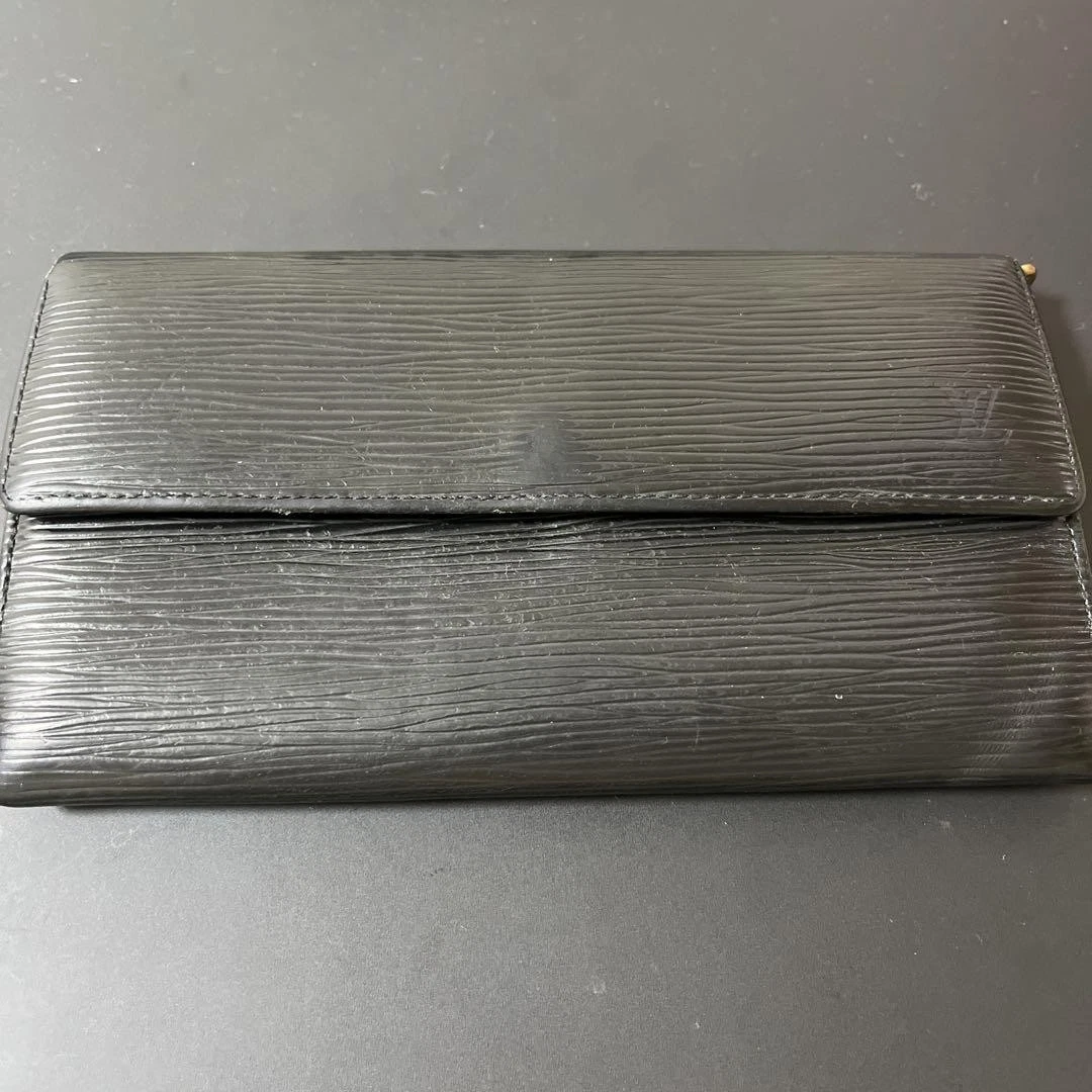 Portefeuille Dior à deux volets occasion petites éraflures bon état design classique