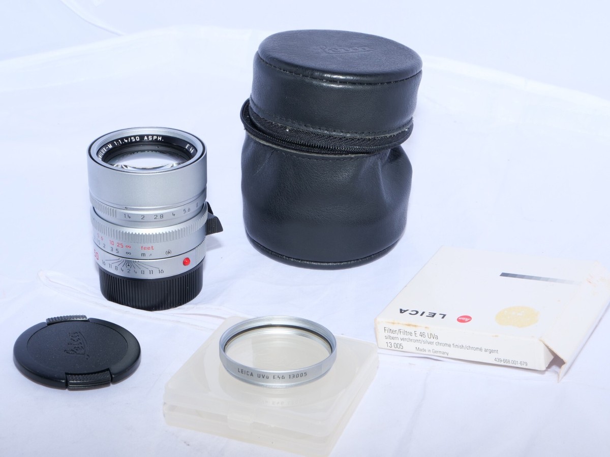 Leica Summilux-M 50mm F/1.4 silver ASPH lens. 6 bit. Case Leica Summilux-M 50mm F/1.4 silver ASPH lens. 6 bit. Case