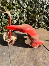 red antique childrens tricycle