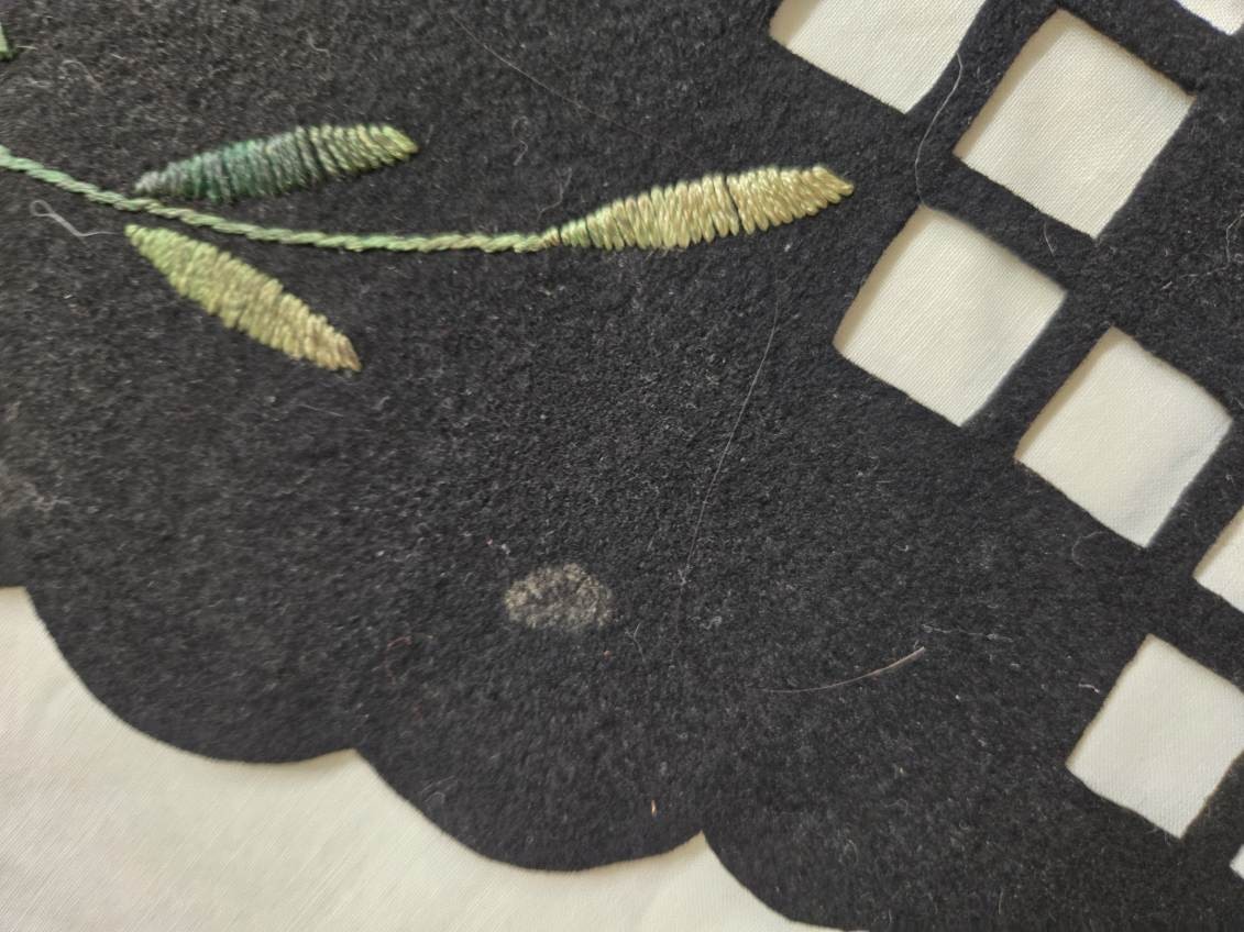 Vtg. black felt table runner w/stitched floral designs and cutout areas.