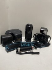 Minolta Maxxum 5000 Camera and 2 AF Lenses plus Flash, Handle, AndCases - Works