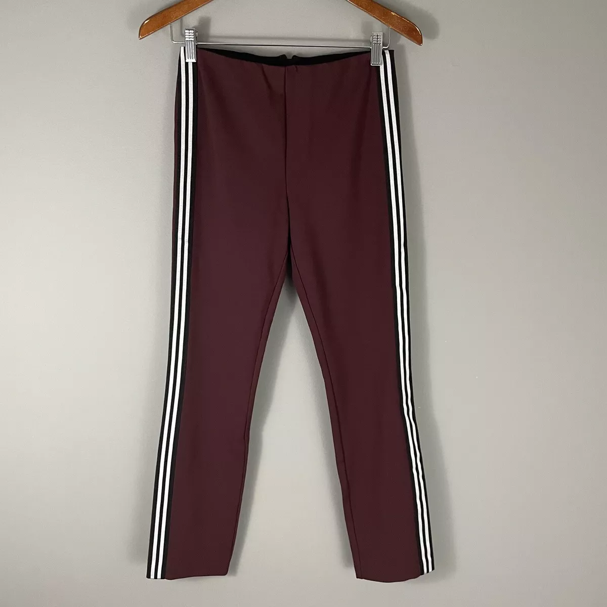 Black pants with two white stripes 2025