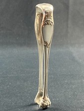 Pince à sucre en métal argenté de style Louis XV signée Cailar Bayard