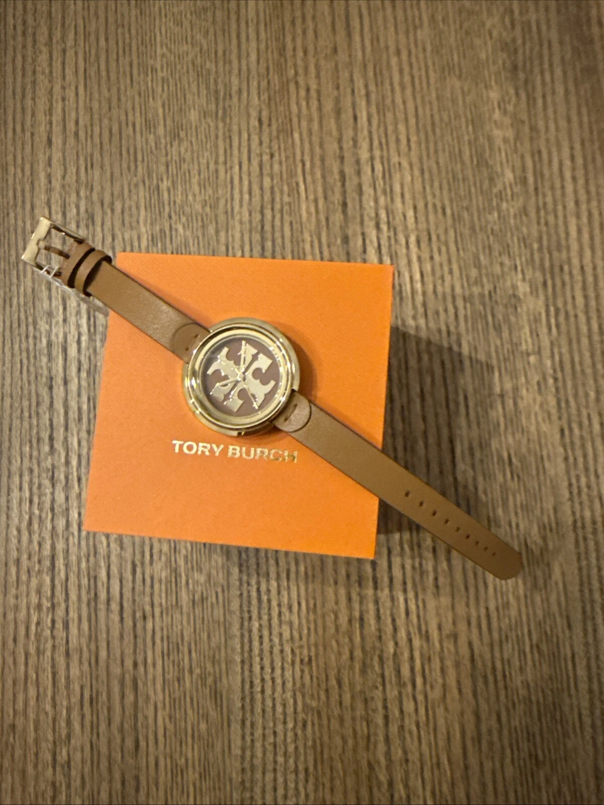 Orologio da donna Tory Burch oro e marrone bagagli pelle mugnaio TBW6201