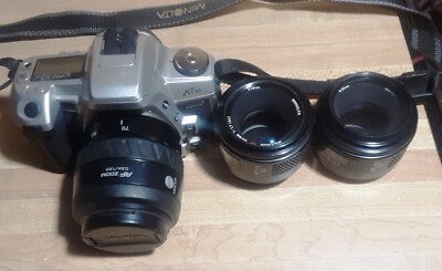 Minolta Maxxum XTsi SLR w/35-70mm AF Zoom w/Cap also two 50mm lens's and strap