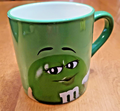 M&M Green Ceramic Coffee Mug EAT YOUR HEART OUT DARLING Blow Kisses Sassy