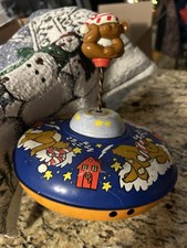 Vintage Ohio Art metal spinning top, 1960s, design of a sleepy teddy bear.