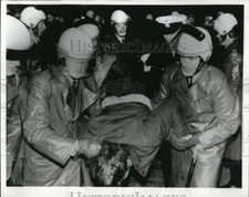 1969 Press Photo Anti-NPD demonstrator carried from scene youths stage protest