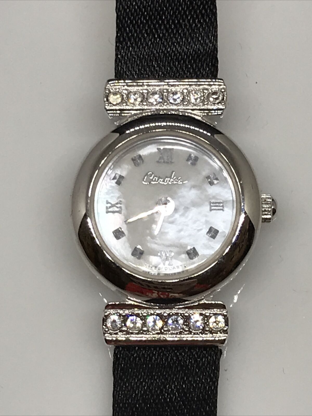 Vintage Carolee Black silk feel band, Mother of Pearl Face with CZ accents Watch