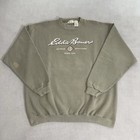 Olive green vintage Eddie Bauer sweatshirt size L with white “Eddie Bauer Outdoor Outfitters Since 1936” text and logo.