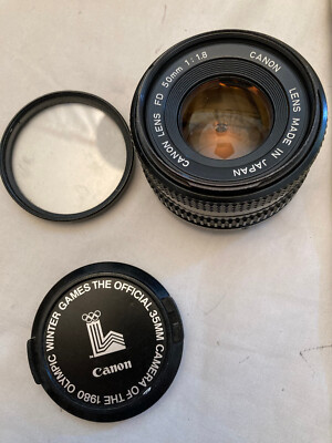 Canon Lens FD 50mm 1:1.8 lens cover and 52mm skylight filter Canon Lens FD 50mm 1:1.8 lens cover and 52mm skylight filter