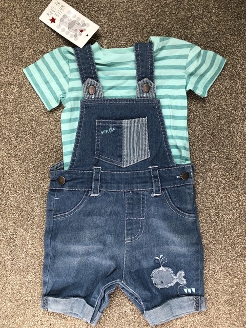 green dungarees baby