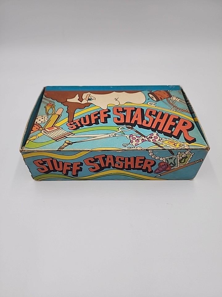 A 1970s 'Stuff Stasher' pencil box with barely-coded reefer humor — a genuinely rare piece of countercultural kitsch that doubles as a desk conversation starter.