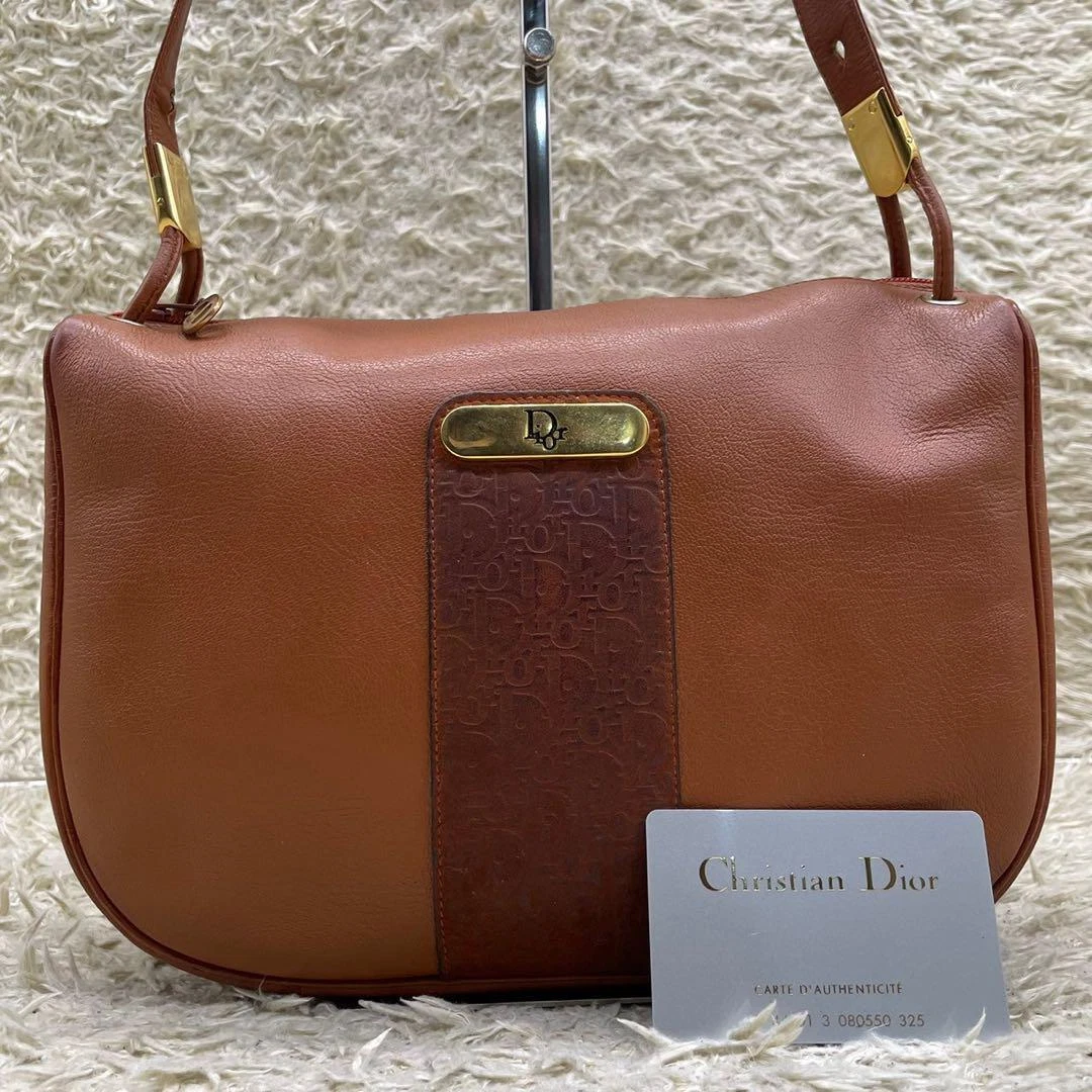 Sac fourre tout bandoulière Christian Dior Trotter en cuir 21x28x5cm,