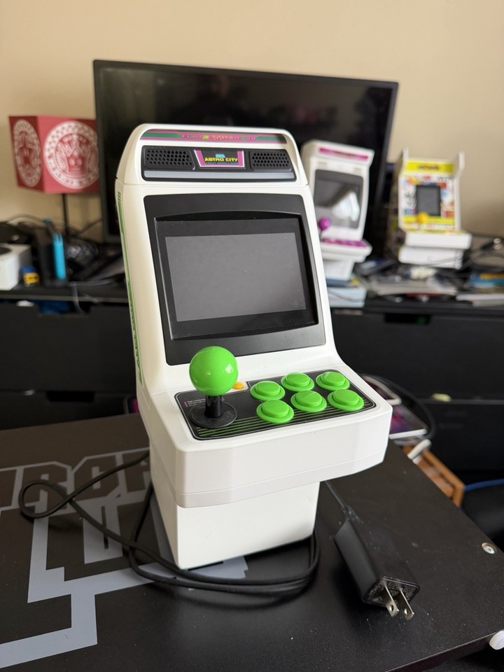 Sega's Astro City Mini arcade cabinet — a faithful desktop replica of the iconic Japanese arcade hardware, with a custom riser to complete the look.