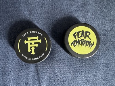 Fear Tomorrow Hockey Pucks (2 total)