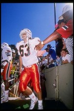 Defensive lineman George Michaels Miami Hurricanes walks on the fi- Old Photo