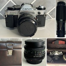 Canon AE-1 Program 35mm Manual SLR Film Camera with 3 Lens and Bag
