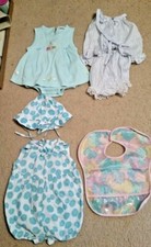 3 Baby girl clothes and a bib:  2 are 3 -6 mo...