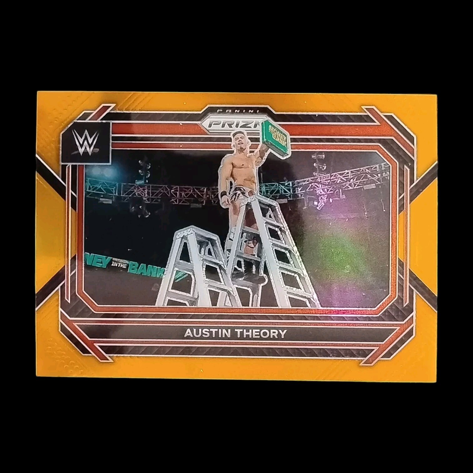 2023 Panini Prizm WWE Orange Prizm /99 Austin Theory #96