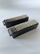 Photos With trays used to hold and feed slides into a compatible projector