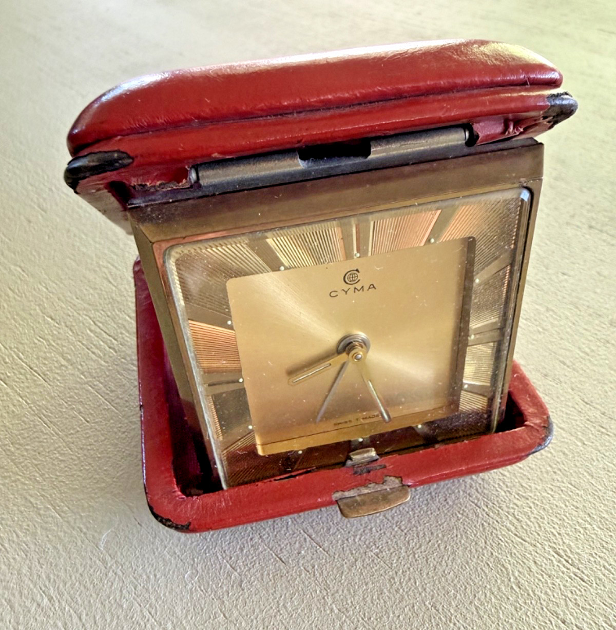 Vintage CYMA Swiss travel alarm clock in red leather case collectible WORKS featured image
