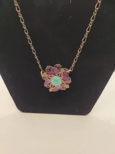 Necklace by Grandmother Buttons. Brass chain w/ purple,green glass design. Vtg.