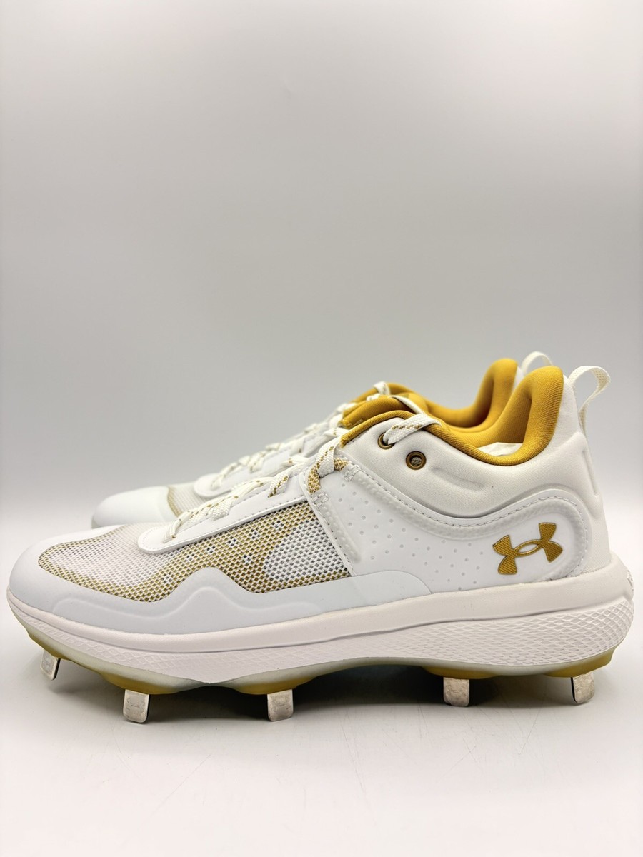 gold and white softball cleats