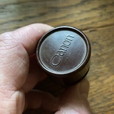 CANON VINTAGE FILM CARTRIDGE AND BAKELITE STORAGE CASE. RARE AND COLLECTIBLE.