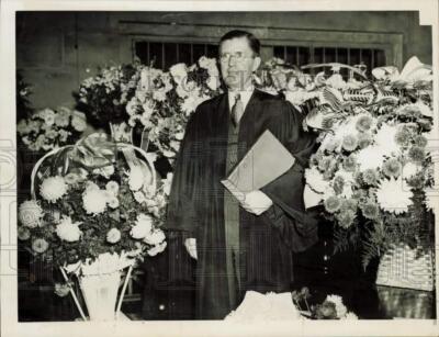 1944 Press Photo Judge John J. Sullivan surrounded by floral arrangements