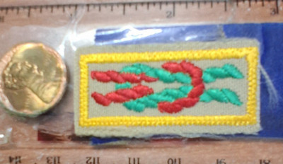 BSA  Arrow of Light Award, leader knot current, tan w/Scoutstuff backing1983-cur
