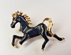 Vintage Black Enamel Gold Tone Galloping Horse Brooch — photo 1
