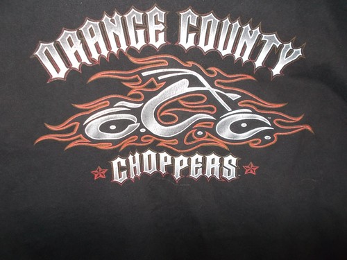ORANGE COUNTY CHOPPERS RED FLAMES AROUND A CHOPPER