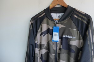 grey and green adidas tracksuit