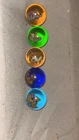 vintage Pokémon glass marbles, likely from the late 1990s Toy Biz collection