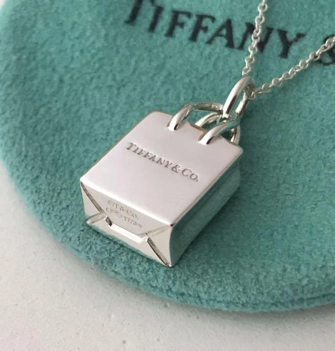 Tiffany & Co.® shopping bag charm in sterling silver with enamel