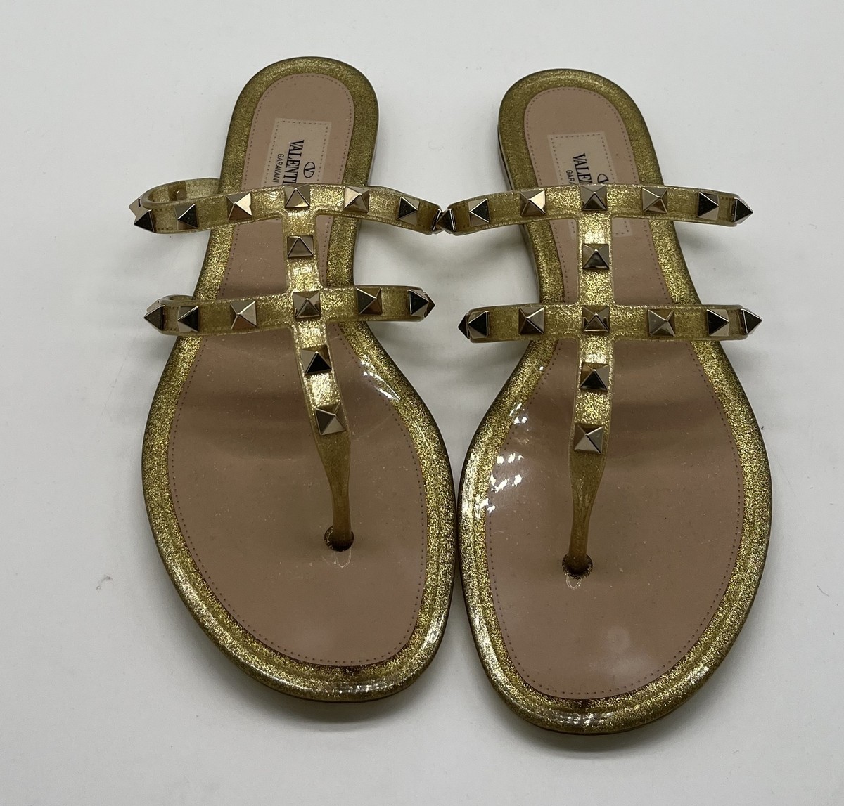 Valentino Garavani Rockstud Jelly PVC Thong Sandals in Gold