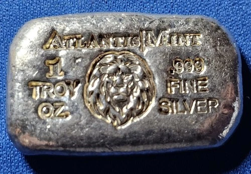 A Atlantis Mint LION- 1 oz .999 Fine Silver Hand Poured Bar