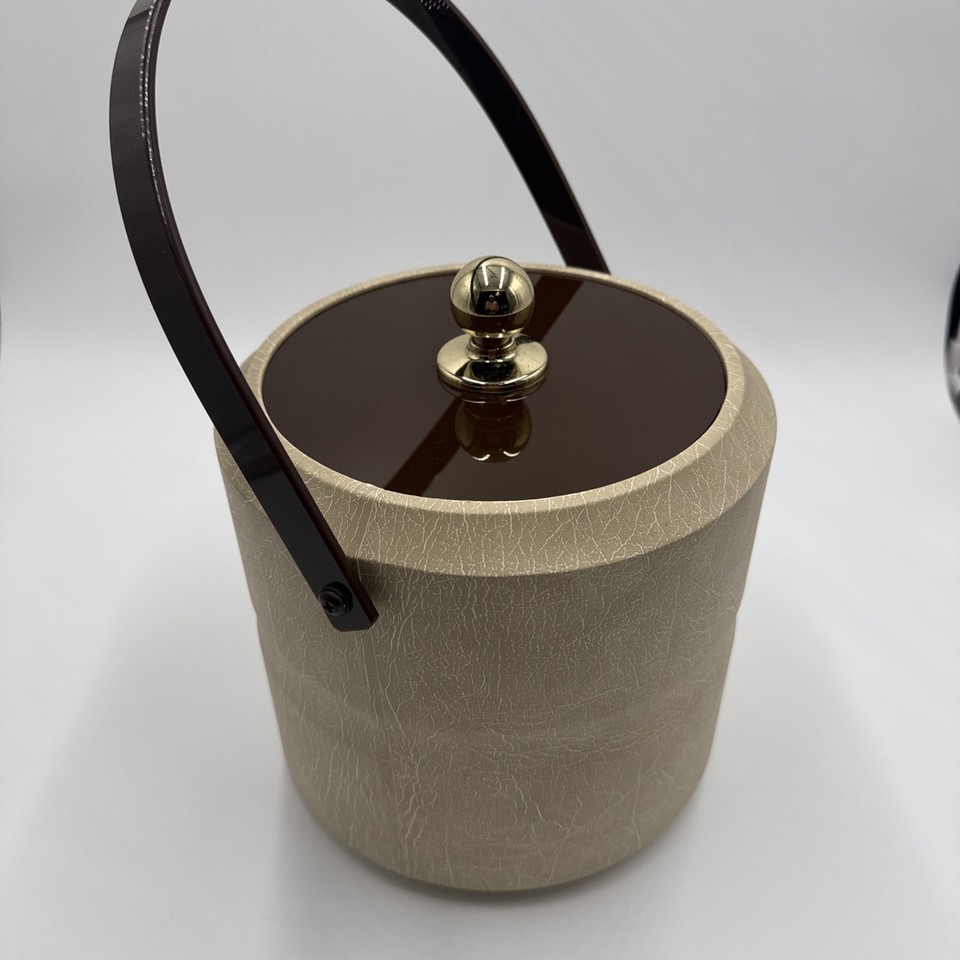 A hefty, Made-in-USA 'Private Stock' vintage ice bucket that feels like it belongs on Don Draper's credenza — serious weight, serious cool.