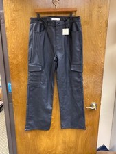 Women "...tgla..."blk faux leather chino type pants w/cargo pocket.Size 17/18
