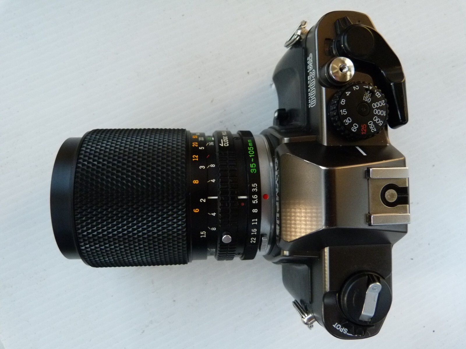 OLYMPUS OM2000 spot metering 35mm SLR Film Camera with 35-105/3.5-4.5 lens. READ