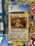 Pokémon TCG Dragonite Fossil 4/62 Holo 1999-2000 WotC. CGC 7 Near Mint