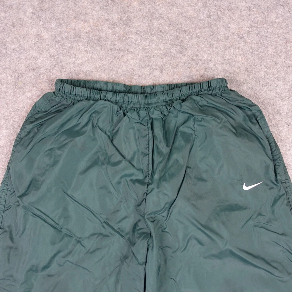 Pantalones deportivos cortavientos Swoosh verde medio vintage Nike para mujer años 90 Foto 2 de 4