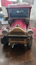 Vintage tin toy car appears to be a 1950s Yonezawa "Grand-Pa Car" Model T