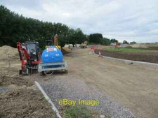 Photo 6x4 Tank on the Roadway Chilton Water tank left beside a mini digge c2016